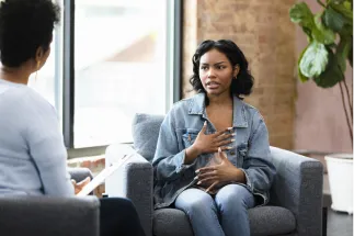 Young female patient talking to a mental health professional