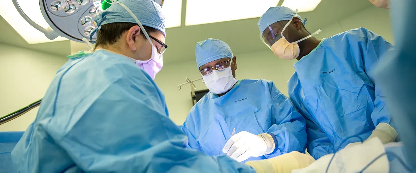 Dr. Britt and colleagues in surgery on an acute surgery case