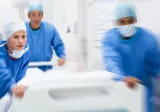 Doctors rushing a patient to surgery
